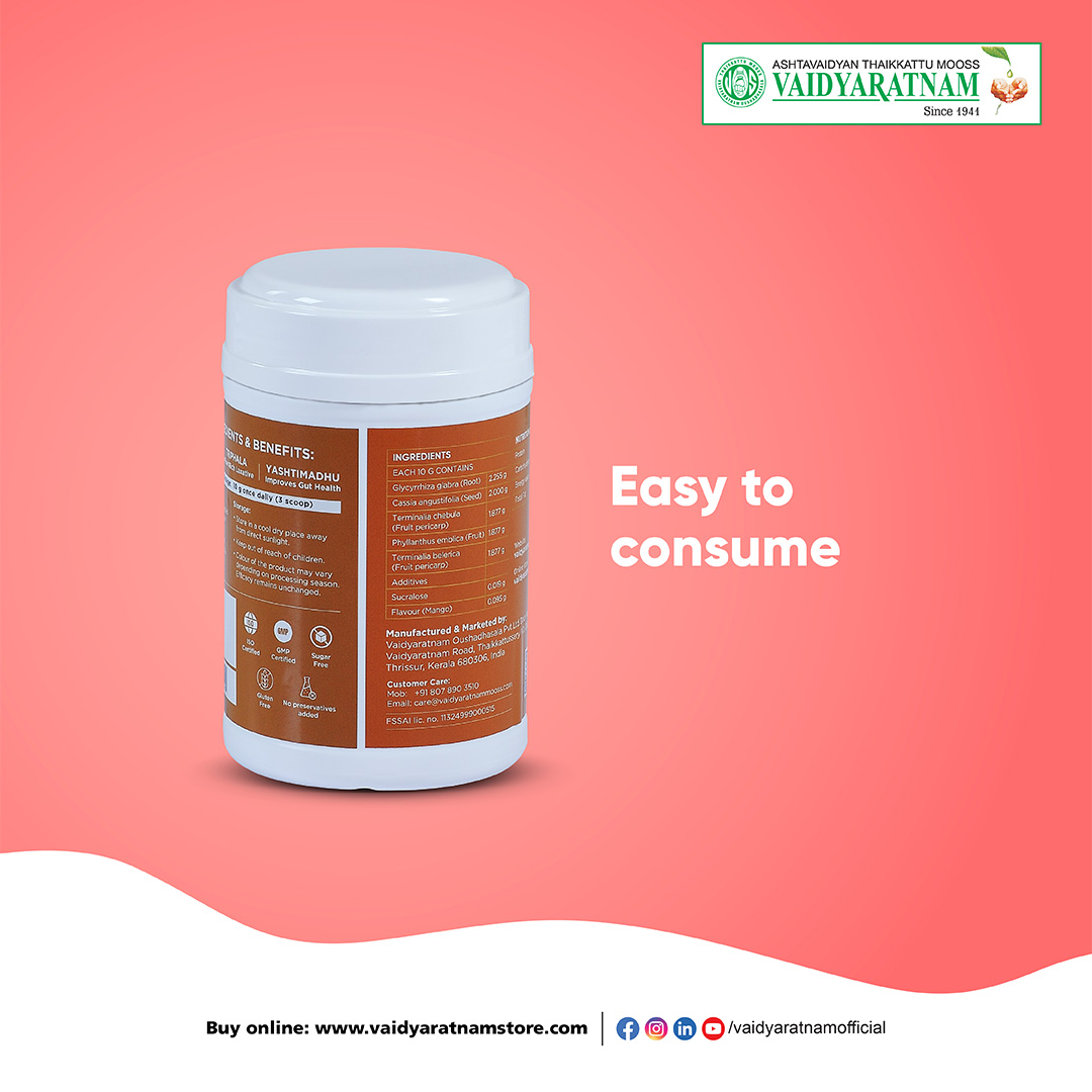 Pharmacist handing a box of over-the-counter laxative medicine to a customer at a pharmacy counter.